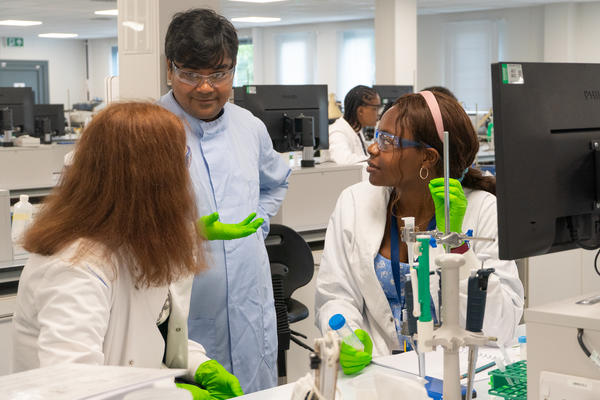 Students and a teacher doing an experiment in an Oxford lab