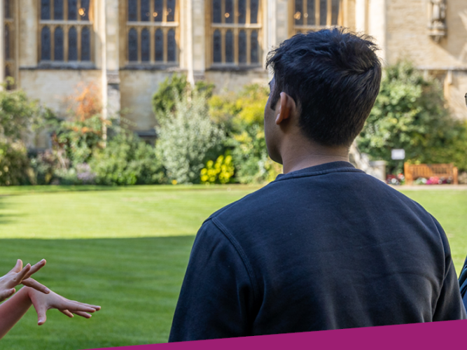 Photo of an Oxford University student ambassador talking to a prospective applicant and parent on a sunny college lawn