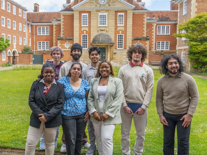 Vee Kativhu and Astrophoria Foundation Year Students standing in the main quad at Lady Margaret Hall College
